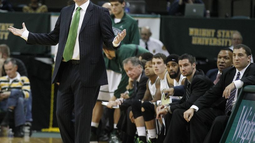 Wright State coach Billy Donlon talks to his players during an exhibition game against Findlay at the Nutter Center on Friday, Nov. 1, 2013. David Jablonski/Staff