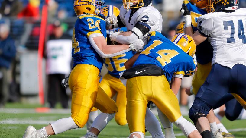 Marion Local's Darren Meier (24) and teammate Landon Arling (14) make a tackle against Kirtland in the Division VI state football championship in Canton on Saturday, Dec. 3, 2022. Meier was named Ohio's Division VI Co-Defensive Player of the Year on Monday. Michael Cooper/CONTRIBUTED