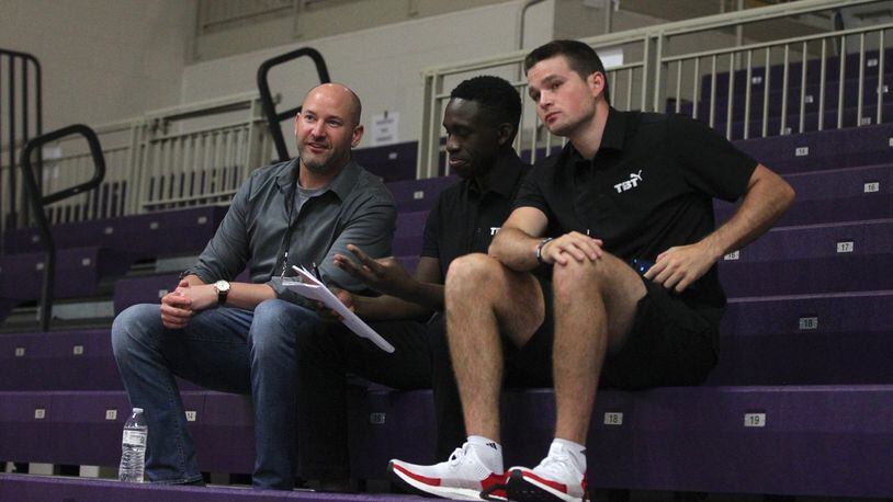 Nick Elam, left, talks to Red Scare co-founders Jeremiah Bonsu, center, and Joey Gruden during The Basketball Tournament on Friday, July 19, 2019, at Capital University in Bexley. Elam is a 2004 UD graduate who created the Elam Ending, a new way of ending basketball games that is being used by The Basketball Tournament. David Jablonski/Staff
