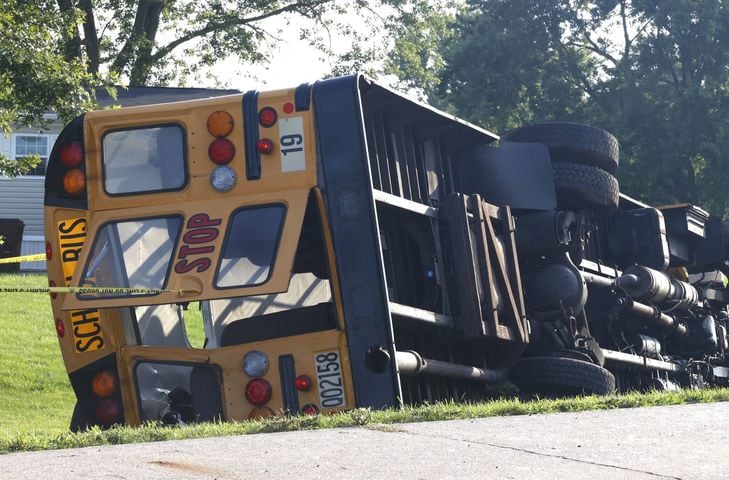 One killed after Northwestern school bus overturns in crash