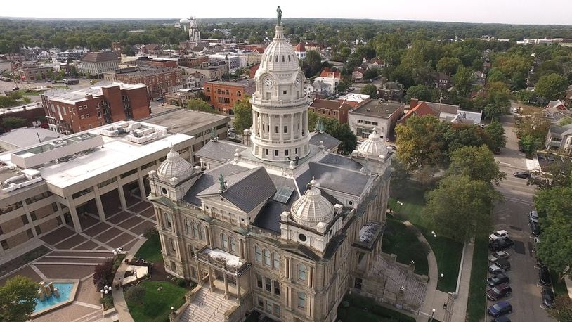 The Miami County Courthouse in Troy seen from the air as contractors prepare to paint the corner domes.   TY GREENLEES / STAFF