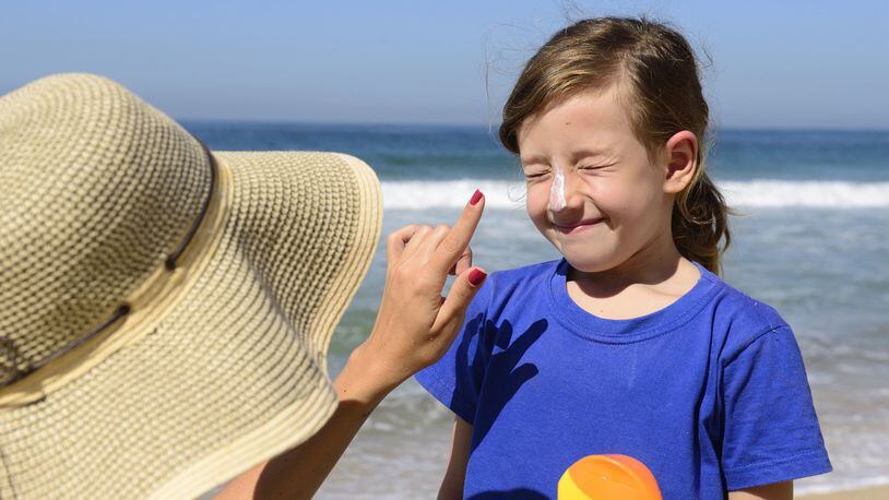 A study out of Australia found that childhood use of sunscreen can reduce the risk of the deadliest form of skin cancer by 40 percent in young adults. (Dreamstime)