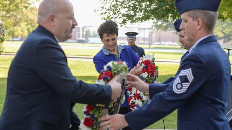 Retired Air Force Col. Cassie Barlow and retired Senior Master Sgt. David McCoy, lay wreaths at the POW/MIA Recognition Day memorial at the Arnold House during a ceremony at Wright-Patterson Air Force Base Sept. 21. (U.S. Air Force photos/Wesley Farnsworth)