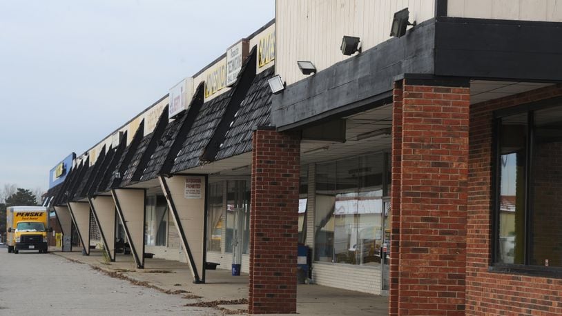 The city of Huber Heights has plans to tear down the Marian shopping center once all tenants have left. MARSHALL GORBY\STAFF