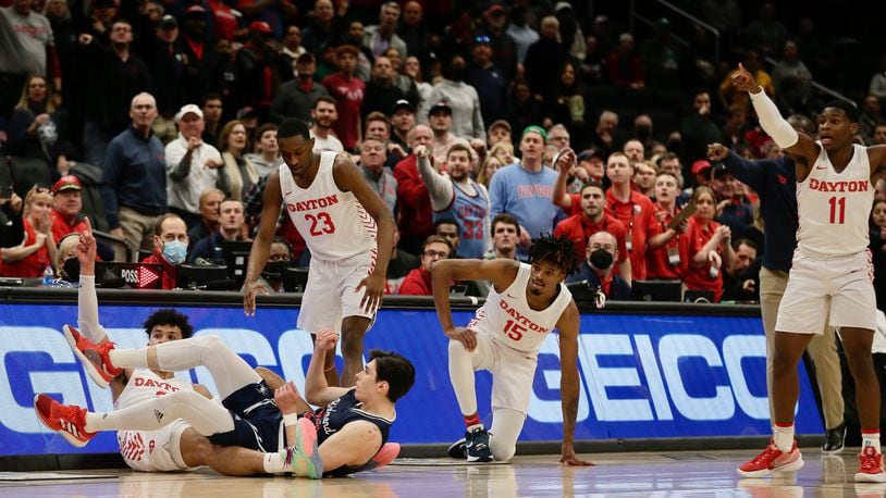 Dayton and Richmond go after a loose ball in the semifinals of the Atlantic 10 Conference tournament on Saturday, March 12, 2022, at Capital One Arena in Washington, D.C. David Jablonski/Staff