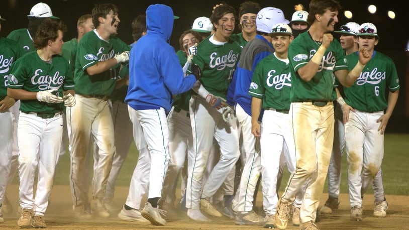 Chaminade Julienne celebrates Christian Gongora (middle) and his walkoff single that lifted the Eagles to a 1-0 victory over Indian Hill in Thursday night's district final at Cincinnati Princeton. Jeff Gilbert/CONTRIBUTED