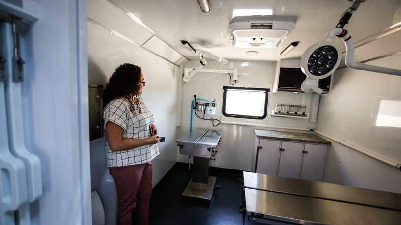 P.I.O. and Business Services for the Animal Resource Center, Kara Hamby stands in the mobile animal surgical lab at the center Monday May 9, 2022. Because of COVID-19, the last few years, the mobile clinic has had limited use but the center plans to visit multiple events in 2022. JIM NOELKER/STAFF