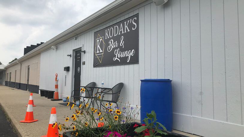 A Huber Heights mother, Sophfronia Puckett-Lattimore, has opened  Kodak's Bar & Lounge in Huber Heights to leave a legacy for her adult children. MARK FISHER/STAFF