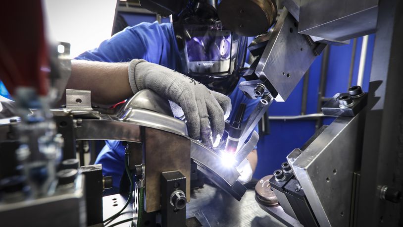 An aerospace welder at work at GE Aviation/Unison in Beavercreek. Contributed