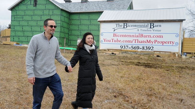 Chris Koehler and Jing Wang are planning to open an event space at The Bicentennial Barn on Bellfontaine Road in Huber Heights. MARSHALL GORBY\STAFF