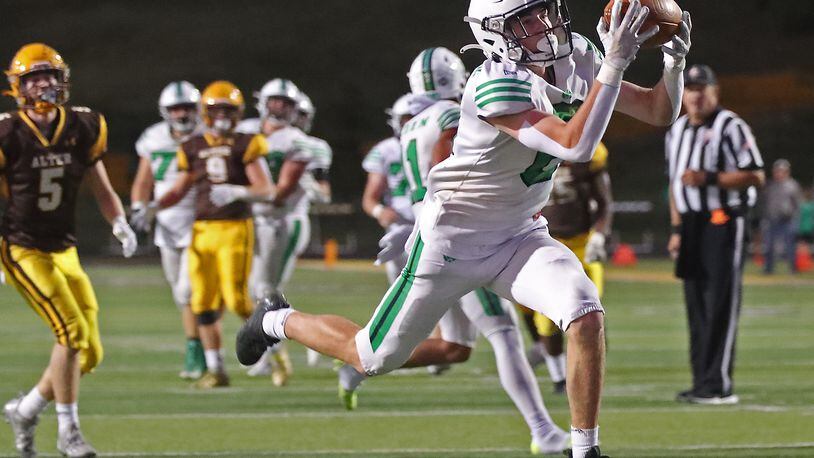 Badin's Quinn Brennan catches a touchdown pass during Friday's game against Alter at Centervilley High School. Bill Lackey/STAFF