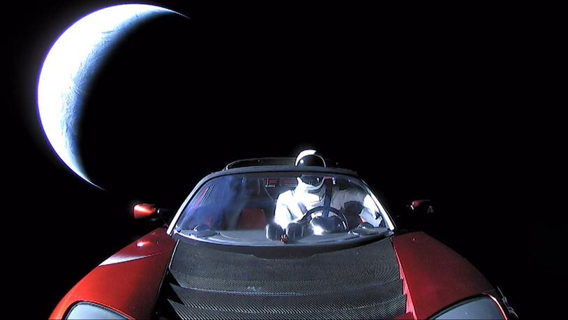 In this handout photo provided by SpaceX, a Tesla roadster launched in early February from the Falcon Heavy rocket with a dummy driver named ‘Starman.’ IT is heading toward Mars. (Photo by SpaceX via Getty Images)
