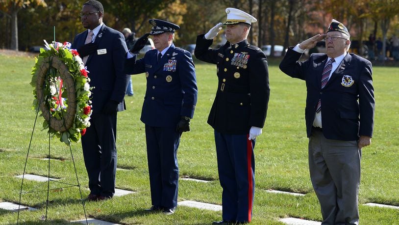 Air Force Chief of Staff Gen. David L. Goldfein salutes after placing a wreath during a Veterans Day ceremony at Quantico National Cemetery in Quantico, Va., Nov. 11, 2017. The Veterans Day ceremony is an annual event hosted by the Potomac Region Veterans Council. The event featured a performance by the Quantico Marine Corps Band. (U.S. Air Force photo by Tech. Sgt. Dan DeCook)