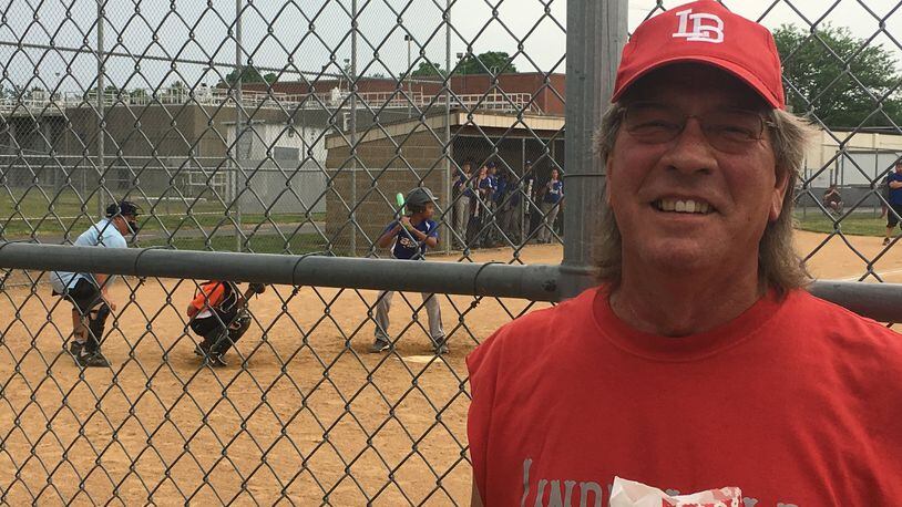 Virgil Cook, a resident of Hamilton’s Lindenwald neighborhood, has been coaching baseball and softball for 25 years. He said he watches games five or six days each week through the spring and summer seasons. MIKE RUTLEDGE/STAFF