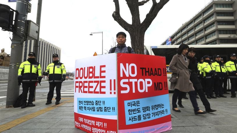 A protester stands to oppose the United States’ policies against North Korea near U.S. Embassy in Seoul, South Korea, Friday, March 9, 2018. After months of trading insults and threats of nuclear annihilation, Trump agreed to meet with North Korean leader Kim Jung Un by the end of May to negotiate an end to Pyongyang’s nuclear weapons program, South Korean and U.S. officials said Thursday. No sitting American president has ever met with a North Korea leader. The signs read: “Oppose Terminal High-Altitude Area Defense (THAAD) .” (AP Photo/Ahn Young-joon)