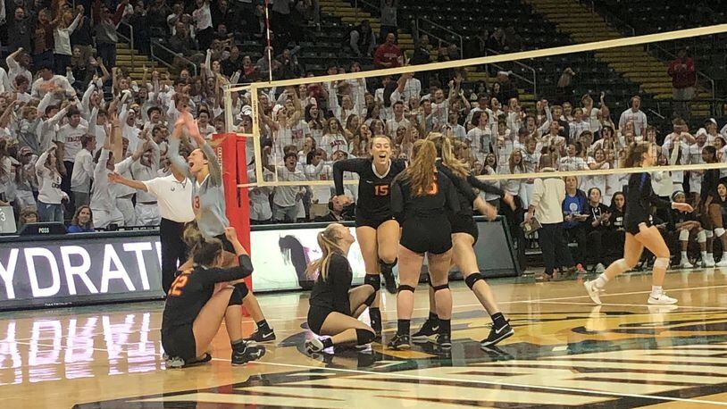 The Fenwick High School girls volleyball team celebrates its five-set win over Gilmour Academy in the Division II state semifinals Thursday at Wright State’s Nutter Center. Debbie Juniewicz/CONTRIBUTED