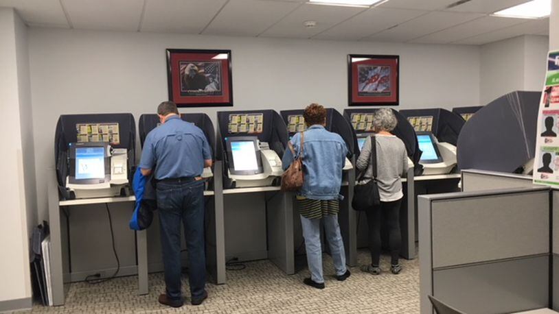 Voters cast ballots at early in-person voting at the Montgomery County Administration Building Sunday afternoon. THOMAS GNAU/STAFF
