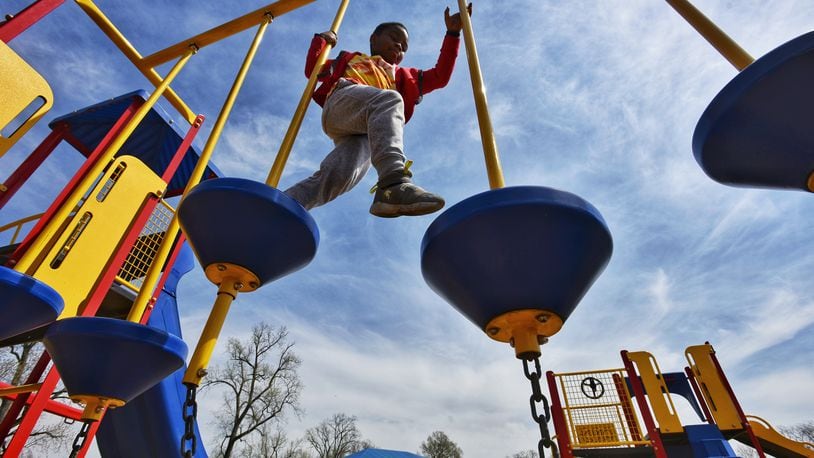 Elisha Butler, 7, plays on the playground at Smith Park Wednesday, April 7, 2021 in Middletown. NICK GRAHAM / STAFF