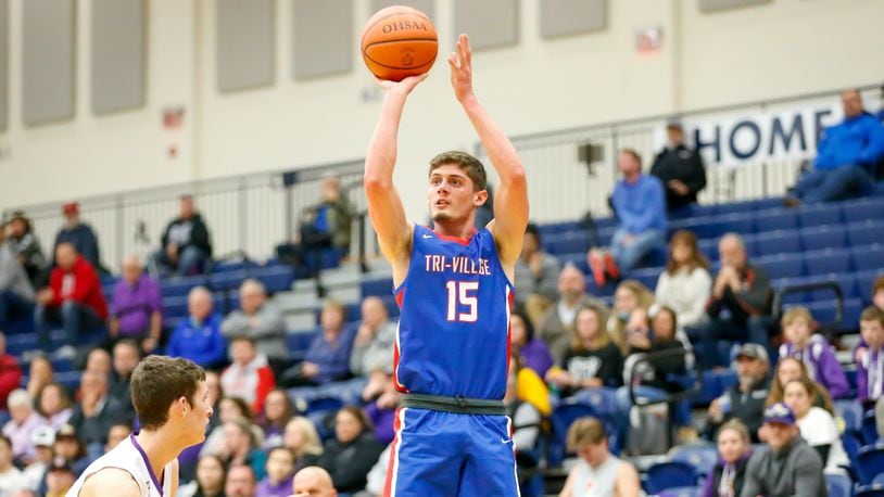 Tri-Village High School senior Layne Sarver shoots the ball during their game against Howard East Knox on Tuesday night at Kettering’s Trent Arena. Sarver scored 32 points as the Patriots won 60-38. CONTRIBUTED PHOTO BY MICHAEL COOPER