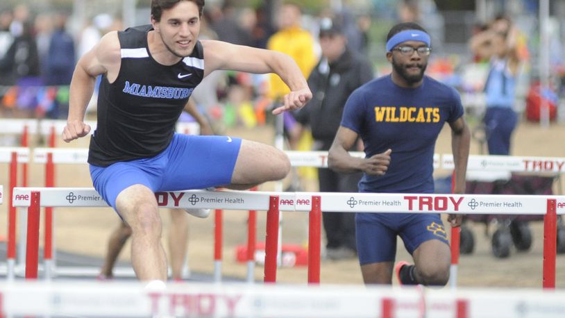 Miamisburg senior Colin Dillon (left), shown at the recent GWOC meet, won the 110-meter high hurdles and 300 hurdles in the D-I district at Bellbrook. MARC PENDLETON / STAFF