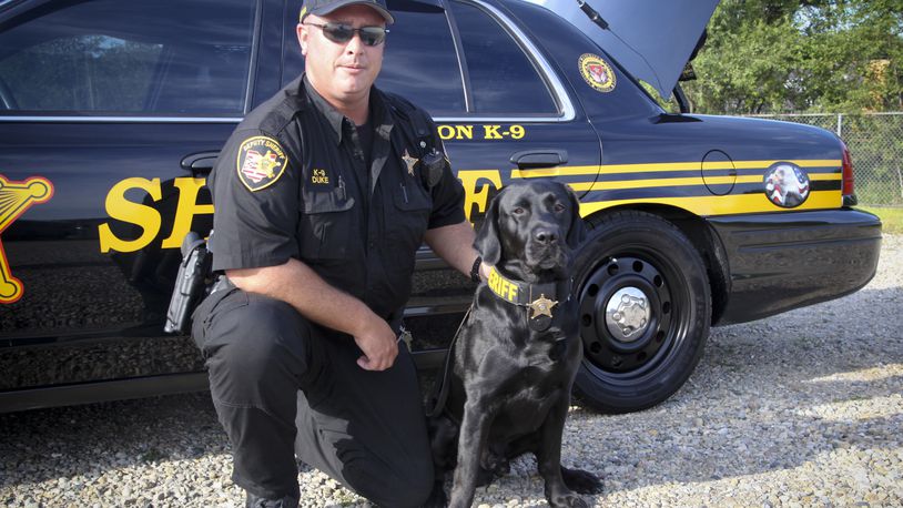 Butler County Sheriff’s Office canine officer Jeff Duke and his dog, Jackson. GREG LYNCH / STAFF
