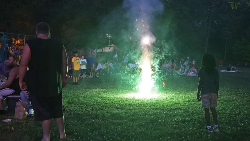 Hundreds of people gathered in Veteran's Park in Springfield on July 3 for the Buck Creek Boom fireworks show to start. BILL LACKEY/STAFF