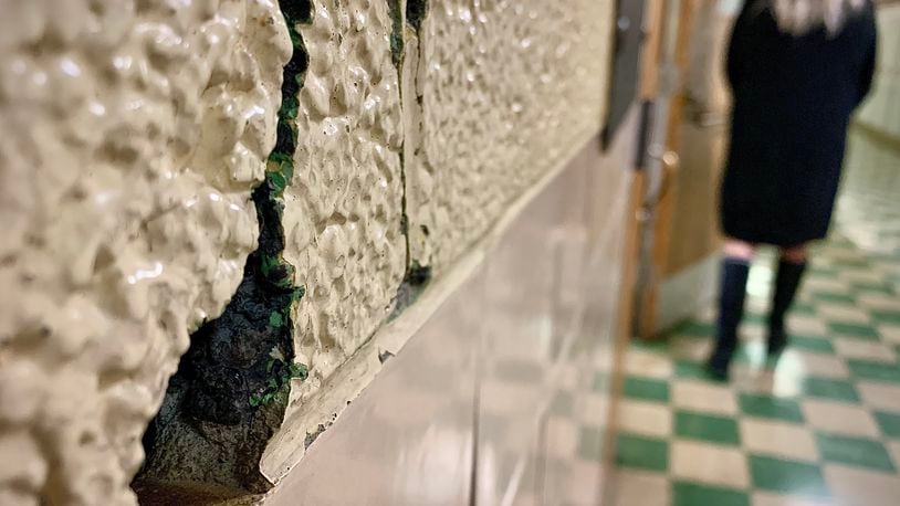 One of the several cracks and holes in the walls at the Broadway  Elementary School in Tipp City. MARSHALL GORBY\STAFF