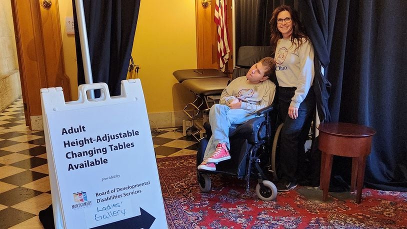 Jennifer Corcoran and her son, Matthew, helped guide people to the adult changing table set up at the Ohio Statehouse in Columbus in March. The pair advocate for accessibility and inclusion for adults with disabilities. Photo provided by the Montgomery County Board of Developmental Disabilities.