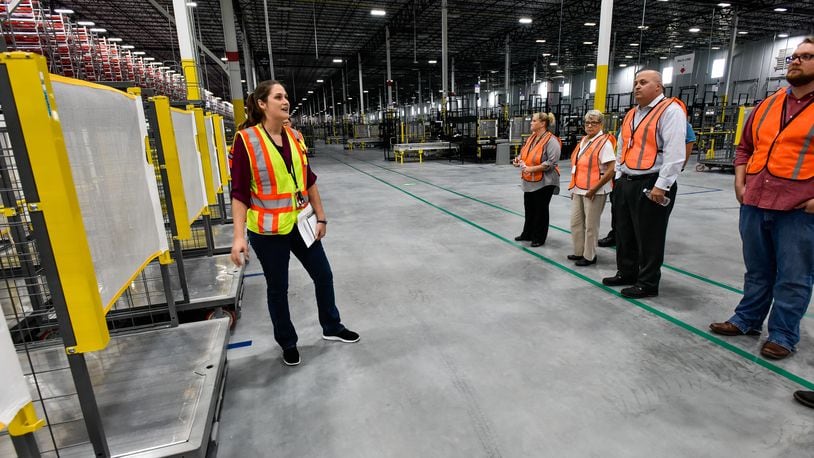 Employees at the Amazon Fulfillment Center in Monroe will make at least $15 per hour. NICK GRAHAM/STAFF