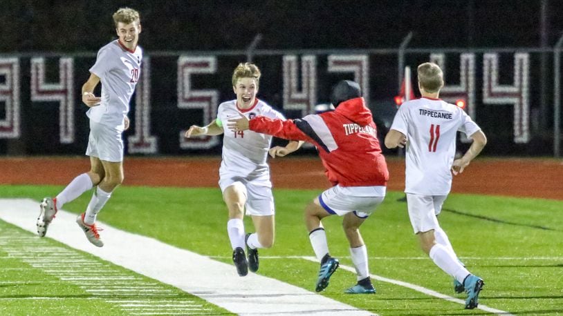 Members of the Tippecanoe High School boys soccer team celebrate after beating Columbus Academy 1-0 in a Division II state semifinal match on Wednesday night at London High School’s Bowlus Field. CONTRIBUTED PHOTO BY MICHAEL COOPER