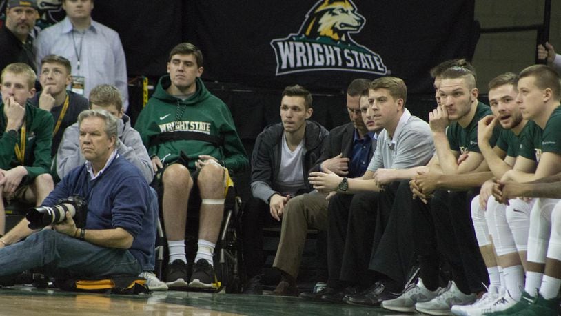 Former Wright State teammates Ryan Custer and Mike LaTulip during Friday night’s game at the Nutter Center. ALLISON RODRIGUEZ / CONTRIBUTED