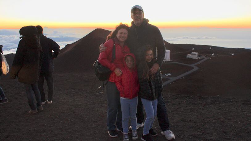 The author, his wife, Megan, and daughters Lily and Madeline brave= the wind and cold at the summit of Mauna Kea.(Rex Crum/Bay Area News Group/TNS)