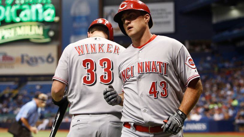 ST. PETERSBURG, FL - JUNE 19:  Scott Schebler #43 of the Cincinnati Reds celebrates with teammate Jesse Winker #33 after hitting a home run off of pitcher Jake Odorizzi of the Tampa Bay Rays during the fifth inning of a game on June 19, 2017 at Tropicana Field in St. Petersburg, Florida. (Photo by Brian Blanco/Getty Images)