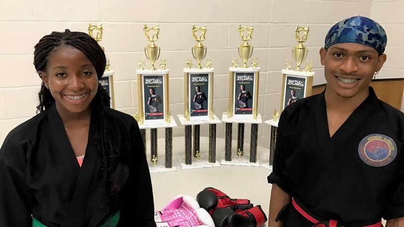 Sidnei Byrd and Vincent Jackson with the trophies they won at the prestigious  Battle of Atlanta completion in Georgia last month. Jackson was first in weapons, sparring and forms.  while Byrd was tops in weapons and sparring and third in forms. Tom Archdeacon/STAFF