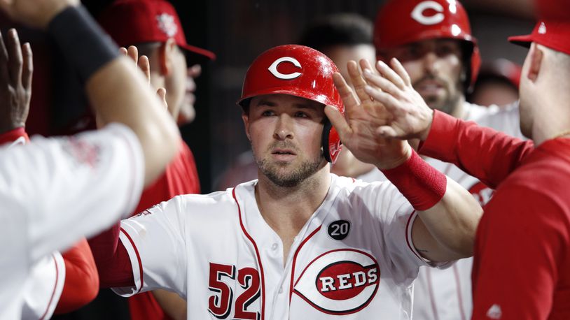 CINCINNATI, OH - JUNE 17: Kyle Farmer #52 and Curt Casali #12 of the Cincinnati Reds celebrate in the dugout after scoring runs in the fifith inning against the Houston Astros at Great American Ball Park on June 17, 2019 in Cincinnati, Ohio. The Reds won 3-2. (Photo by Joe Robbins/Getty Images)