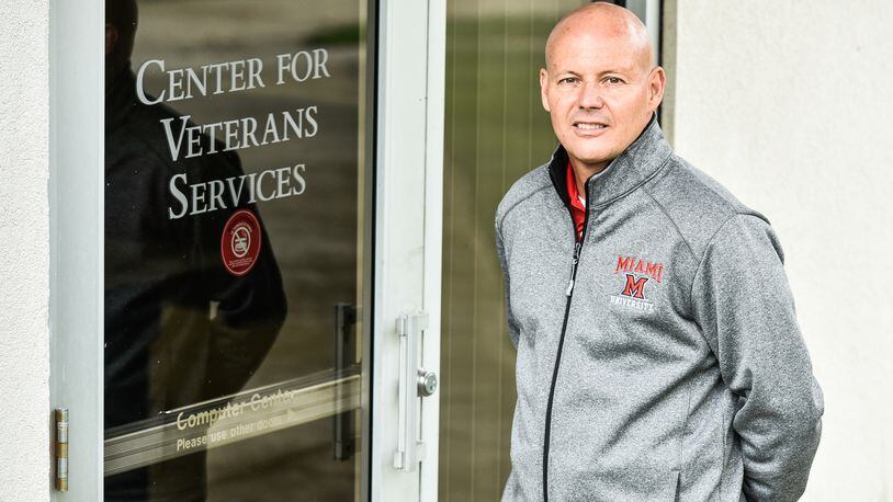 J.P. Smith, Regional Coordinator of Veterans Services for Miami Regionals, stands in front of the Center for Veterans Services on the Miami University Middletown Campus Wednesday, April 25 in Middletown. Miami University Regionals was awarded a federal grant from the National Endowment for the Humanities to facilitate its 2018-2019 project “From War Zone to Home: A Humanities Dialogue.” NICK GRAHAM/STAFF