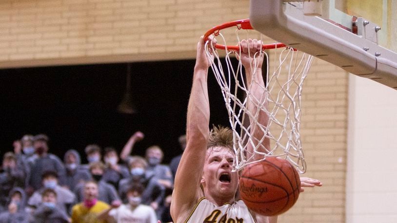 Alter senior Brian Shane dunks for his 16 points in the Knights' 66-53 victory over Cincinnati Roger Bacon on Friday night at Alter. Jeff Gilbert/CONTRIBUTED