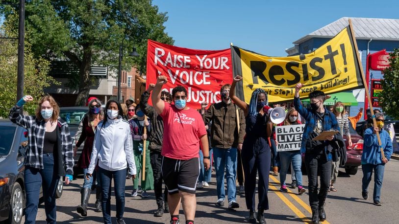 At a weekly Black Lives Matter protest in Yellow Springs on Saturday, Sept. 19, demonstrators marched downtown, blocking traffic. Marchers shouted the names of Black people killed by police officers and chanted things like, "when Black lives are under attack, what do we do? Stand up, fight back."