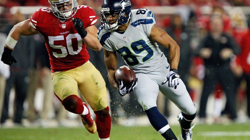 SANTA CLARA, CA - NOVEMBER 27: Wide receiver Doug Baldwin #89 of the Seattle Seahawks takes a pass for a 24-yard gain against linebacker Chris Borland #50 of the San Francisco 49ers in the first quarter on November 27, 2014 at Levi’s Stadium in Santa Clara, California. The Seahawks won 19-3. (Photo by Brian Bahr/Getty Images)