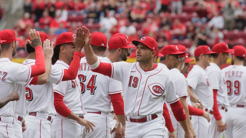 Joey Votto, of the Reds, is introduced before a game between the Reds and Guardians on Opening Day on Tuesday, April 12, 2022, at Great American Ball Park in Cincinnati. David Jablonski/Staff