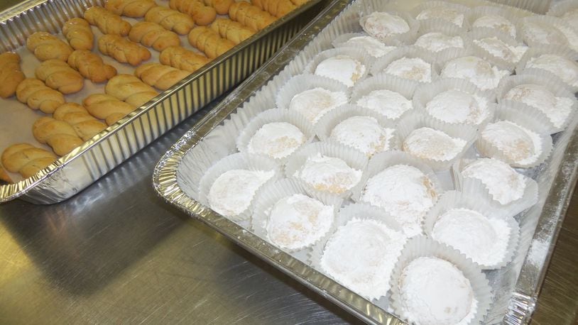 Pans of Koulouria (a Greek butter cookie) and Kourambiedes (a soft butter cookie with powder sugar) from a previous Dayton Greek Festival. FILE