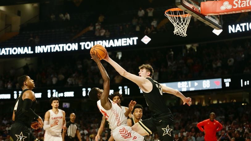 Dayton's Kobe Elvis has a shot blocked in the final seconds in overtime by Vanderbilt's Liam Robbins in the second round of the NIT on Sunday, March 20, 2022, at Memorial Gymnasium in Nashville, Tenn. David Jablonski/Staff