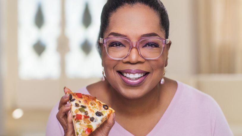 Oprah Winfrey has launched a frozen pizza line under her O! That's Good brand, featuring nutritious ingredients like cauliflower crust. The pizza will be sold in stores nationwide.