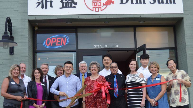 Chamber of Commerce members were on hand to welcome the ownership and staff of Dim Sum restaurant Sept. 18 with a formal ribbon-cutting. Chamber President Kelli Riggs said it is the first Asian restaurant to join the chamber. CONTRIBUTED/BOB RATTERMAN