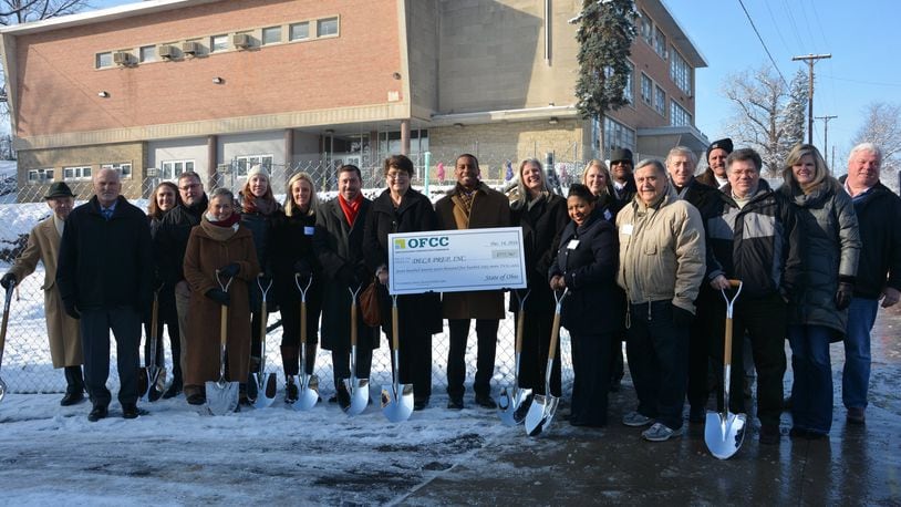 Leaders and supporters of the DECA Prep charter school hold a groundbreaking ceremony Dec. 14, 2016 at the school in Dayton’s Five Oaks neighborhood. The school is expanding slightly for 2017-18 thanks to a state facilities grant. CONTRIBUTED PHOTO