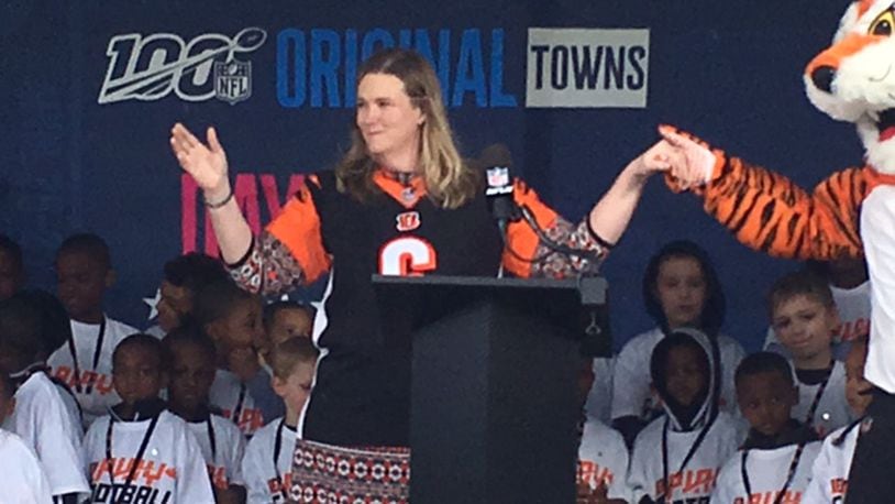 Dayton Mayor Nan Whaley dances with Cincinnati Bengals mascot Who Dey while waiting to announce the team’s first sixth round draft pick Saturday as young members of the city’s flag football organization look on. NICK BLIZZARD/STAFF
