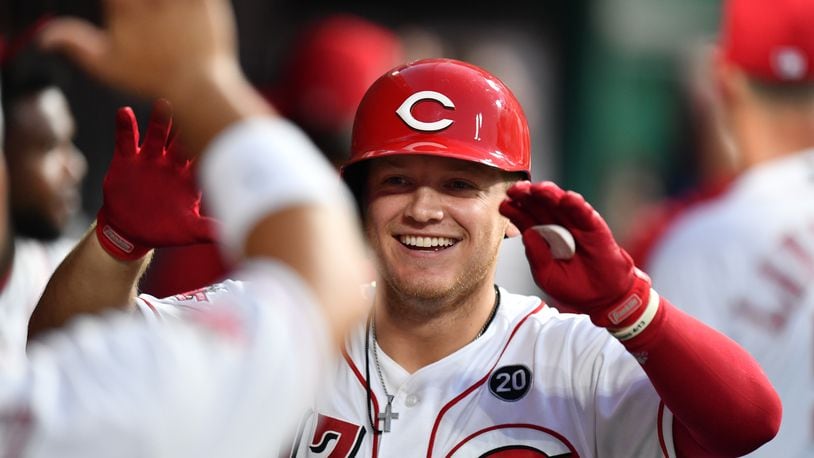 CINCINNATI, OH - JULY 20:  Josh VanMeter #17 of the Cincinnati Reds celebrates in the dugout after hitting a two-run home run in the seventh inning against the St. Louis Cardinals at Great American Ball Park on July 20, 2019 in Cincinnati, Ohio. Cincinnati defeated St. Louis 3-2.  (Photo by Jamie Sabau/Getty Images)