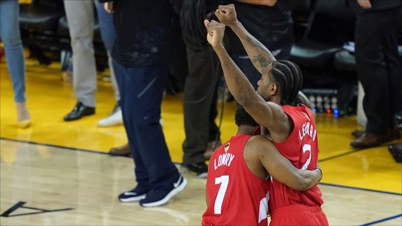 OAKLAND, CALIFORNIA - JUNE 13:  Kyle Lowry #7 and Kawhi Leonard #2 of the Toronto Raptors celebrates his teams win over the Golden State Warriors in Game Six to win the 2019 NBA Finals at ORACLE Arena on June 13, 2019 in Oakland, California. NOTE TO USER: User expressly acknowledges and agrees that, by downloading and or using this photograph, User is consenting to the terms and conditions of the Getty Images License Agreement. (Photo by Thearon W. Henderson/Getty Images)