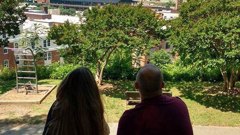 A couple of AmeriVespa 2018 participants admire the Richmond, Virginia, skyline during a Seven Hills of Richmond guided tour. Photo contributed by Gary Honnert