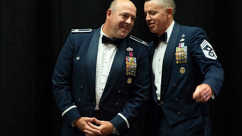 Col. Patrick Miller (left), 88th Air Base Wing and installation commander, chats with Chief Master Sgt. Jason Shaffer, 88 ABW command chief, prior to the start of the Chief Master Sgt. Induction Medallion Ceremony inside the National Museum of the U.S. Air Force on July 10. After a two-year leadership stint, Miller and Shaffer are set to move on to new assignments. U.S. AIR FORCE PHOTO/WESLEY FARNSWORTH